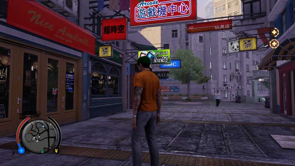 Wei standing in an alleyway with colorful shop signs